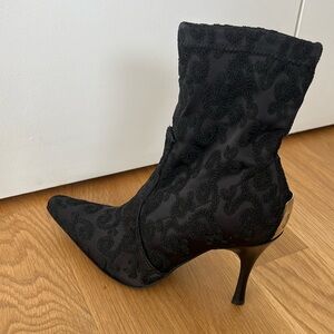 Black Donald Pliner embroidered booties.
